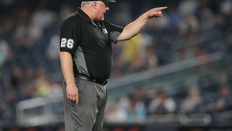Jun 6, 2021; Bronx, New York, USA; second base umpire Bill Miller (26) ejects New York Yankees bench coach Carlos Mendoza (not pictured) during the tenth inning at Yankee Stadium. Mandatory Credit: Brad Penner-USA TODAY Sports