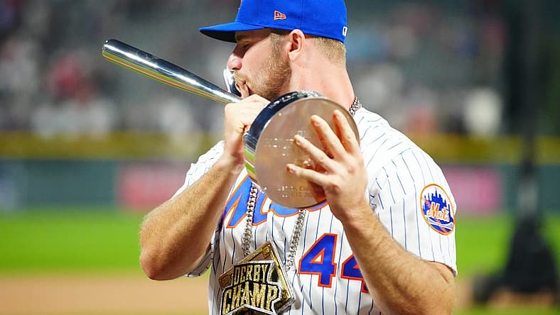Jul 12, 2021; Denver, CO, USA; New York Mets first baseman Pete Alonso poses for photographs with the winners trophy following his victory in the 2021 MLB Home Run Derby. Mandatory Credit: Mark J. Rebilas-USA TODAY Sports