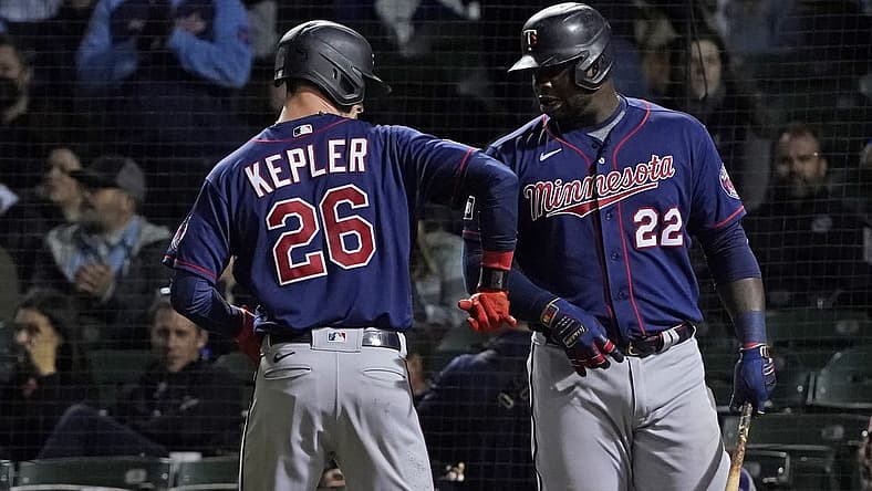 Sep 22, 2021; Chicago, Illinois, USA; Minnesota Twins left fielder Max Kepler (26) is greeted by first baseman Miguel Sano (22) after hitting a home run against the Chicago Cubs during the fourth inning at Wrigley Field. Mandatory Credit: David Banks-USA TODAY Sports