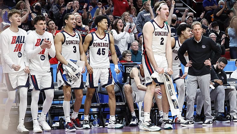 Mar 17, 2022; Portland, OR, USA; Gonzaga Bulldogs forward Drew Timme (2) and guard Rasir Bolton (45) and guard Andrew Nembhard (3) react on the bench in the second half against the Georgia State Panthers as head coach Mark Few looks on during the first round of the 2022 NCAA Tournament at Moda Center. Mandatory Credit: Soobum Im-USA TODAY Sports