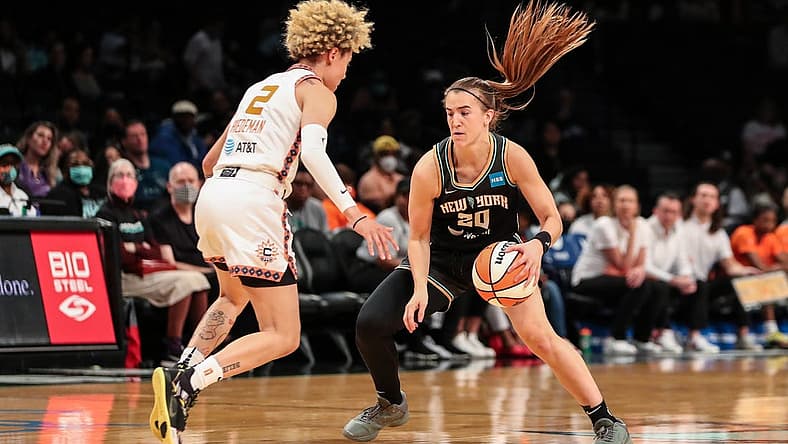 May 17, 2022; Brooklyn, New York, USA; New York Liberty guard Sabrina Ionescu (20) and Connecticut Sun guard Natisha Hiedeman (2) at Barclays Center. Mandatory Credit: Wendell Cruz-USA TODAY Sports