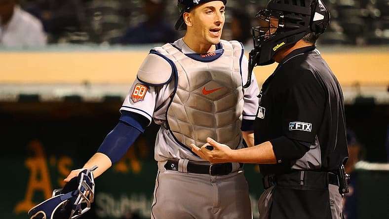 May 31, 2022; Oakland, California, USA; Houston Astros catcher Jason Castro (18) speaks to home plate umpire Manny Gonzalez after a play against the Oakland Athletics during the sixth inning at RingCentral Coliseum. Mandatory Credit: Kelley L Cox-USA TODAY Sports