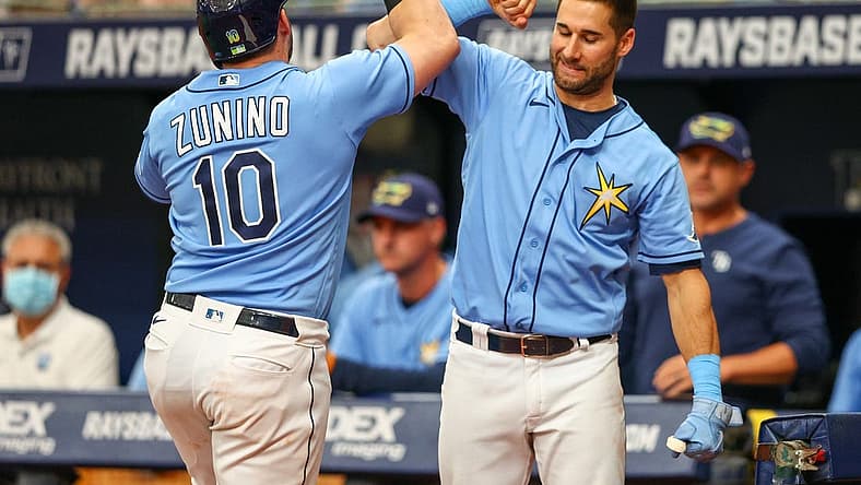 Jun 5, 2022; St. Petersburg, Florida, USA; Tampa Bay Rays catcher Mike Zunino (10) is congratulated by center fielder Kevin Kiermaier (39) after hitting a two-run home run against the Chicago White Sox in the sixth inning at Tropicana Field. Mandatory Credit: Nathan Ray Seebeck-USA TODAY Sports