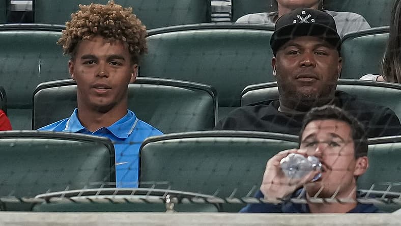 Jun 7, 2022; Cumberland, Georgia, USA; Former Atlanta Braves player Andruw Jones (right) and his son Druw watch the game between the Braves and the Oakland Athletics during the sixth inning at Truist Park. Mandatory Credit: Dale Zanine-USA TODAY Sports