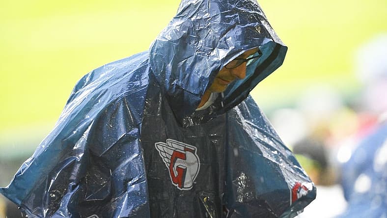 Jun 8, 2022; Cleveland, Ohio, USA; A fan wearing a rain poncho walks to the concourse during a rain delay of a game between the Cleveland Guardians and the Texas Rangers at Progressive Field. Mandatory Credit: David Richard-USA TODAY Sports
