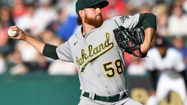 Jun 10, 2022; Cleveland, Ohio, USA; Oakland Athletics starting pitcher Paul Blackburn (58) throws a pitch during the first inning against the Cleveland Guardians at Progressive Field. Mandatory Credit: Ken Blaze-USA TODAY Sports
