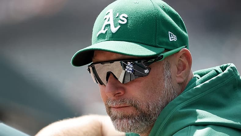 May 12, 2022; Detroit, Michigan, USA; Oakland Athletics manager Mark Kotsay (7) watches from the dugout in the first inning against the Detroit Tigers at Comerica Park. Mandatory Credit: Rick Osentoski-USA TODAY Sports