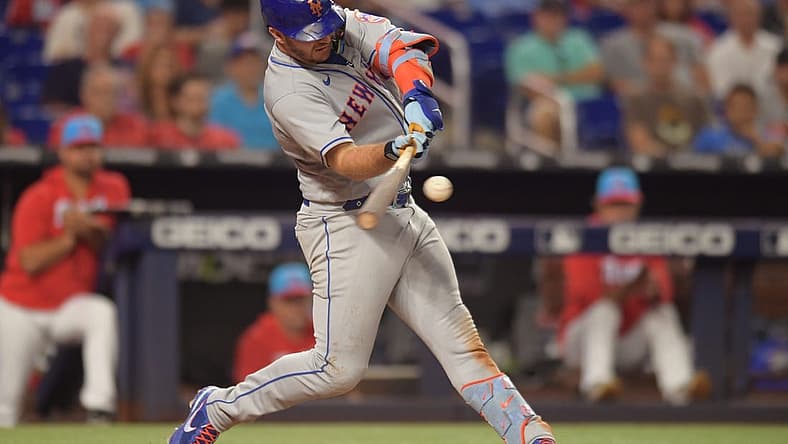 Jun 25, 2022; Miami, Florida, USA; New York Mets first baseman Pete Alonso (20) hits a home run in the eighth inning against the Miami Marlins at loanDepot Park. Mandatory Credit: Jim Rassol-USA TODAY Sports