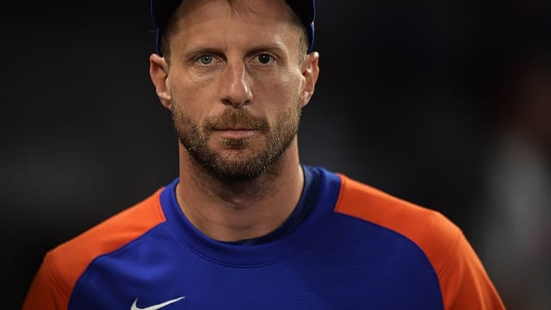 Jun 25, 2022; Miami, Florida, USA; New York Mets pitcher Max Scherzer walks along the dugout during the game against the Miami Marlins at loanDepot Park. Mandatory Credit: Jim Rassol-USA TODAY Sports