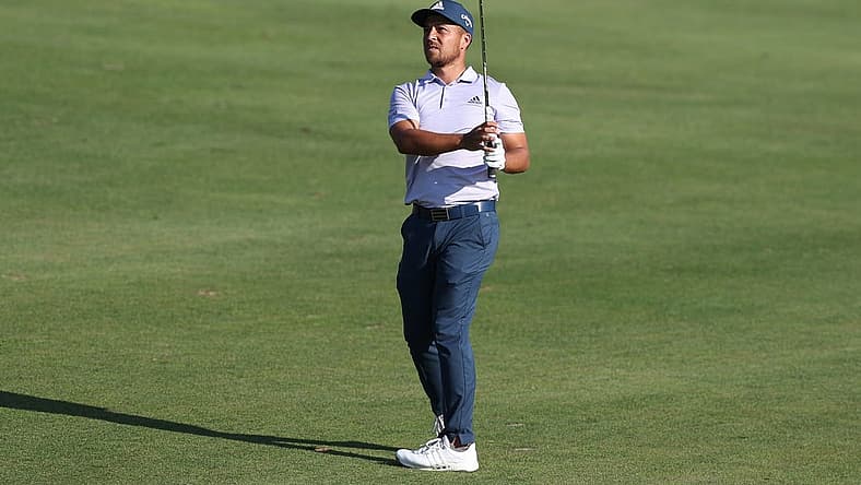 Jun 26, 2022; Cromwell, Connecticut, USA; Xander Schauffele plays a shot from the fairway of the 18th hole during the final round of the Travelers Championship golf tournament. Mandatory Credit: Vincent Carchietta-USA TODAY Sports