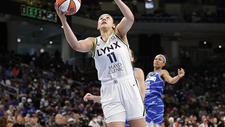 Jun 26, 2022; Chicago, Illinois, USA; Minnesota Lynx forward Natalie Achonwa (11) goes to the basket against the Chicago Sky during the second half of a WNBA game at Wintrust Arena. Mandatory Credit: Kamil Krzaczynski-USA TODAY Sports