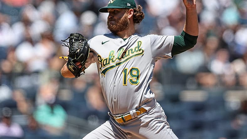 Jun 29, 2022; Bronx, New York, USA; Oakland Athletics starting pitcher Cole Irvin (19) delivers a pitch during the first inning against the New York Yankees at Yankee Stadium. Mandatory Credit: Vincent Carchietta-USA TODAY Sports