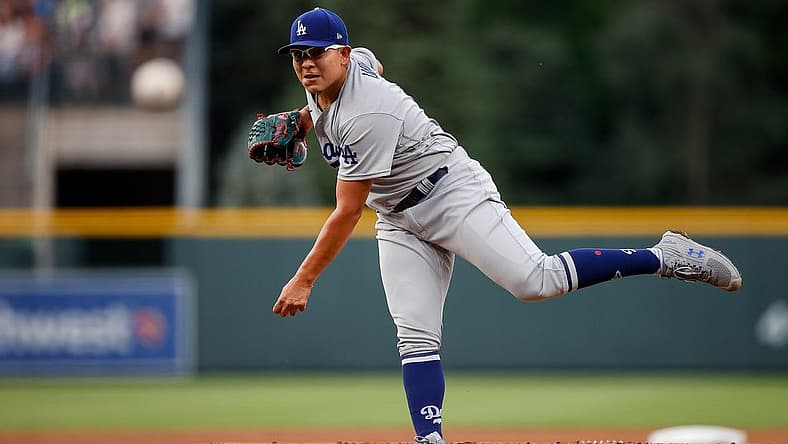Jun 29, 2022; Denver, Colorado, USA; Los Angeles Dodgers starting pitcher Julio Urias (7) pitches in the first inning against the Colorado Rockies at Coors Field. Mandatory Credit: Isaiah J. Downing-USA TODAY Sports