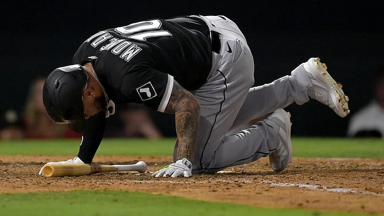 Jun 29, 2022; Anaheim, California, USA; Chicago White Sox third baseman Yoan Moncada (10) hits the ground after fouling a ball off his foot in the eighth inning against the Los Angeles Angels at Angel Stadium. Mandatory Credit: Jayne Kamin-Oncea-USA TODAY Sports