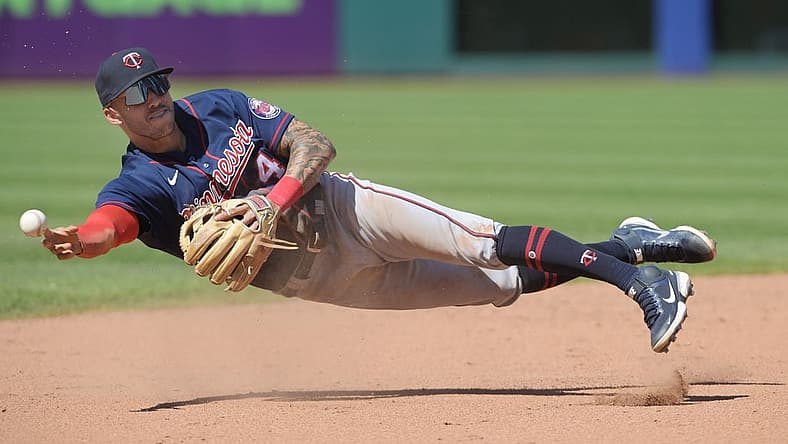 Jun 30, 2022; Cleveland, Ohio, USA; Minnesota Twins shortstop Carlos Correa (4) throws to third after fielding a ball hit by Cleveland Guardians center fielder Myles Straw (not pictured) during the eighth inning at Progressive Field. Correa was charged with a throwing error and two runs scored on the play. Mandatory Credit: Ken Blaze-USA TODAY Sports