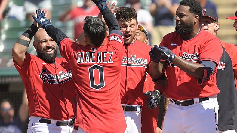 Jun 30, 2022; Cleveland, Ohio, USA; Cleveland Guardians catcher Sandy Leon (4) and catcher Luke Maile (12) and outfielder Franmil Reyes (32) celebrate with second baseman Andres Gimenez (0) after Gimenez hit a game winning two run home run during the ninth inning against the Minnesota Twins at Progressive Field. Mandatory Credit: Ken Blaze-USA TODAY Sports