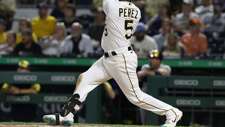 Jun 30, 2022; Pittsburgh, Pennsylvania, USA; Pittsburgh Pirates catcher Michael Perez (5) hits a solo home run against the Milwaukee Brewers during the eighth inning at PNC Park. Mandatory Credit: Charles LeClaire-USA TODAY Sports