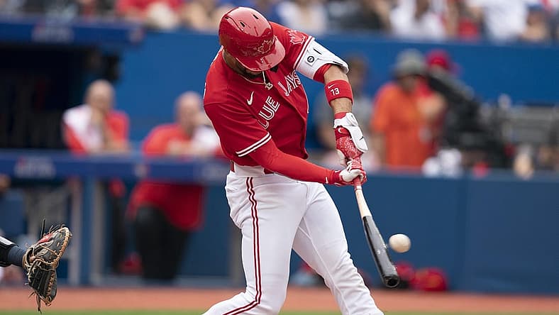 Jul 1, 2022; Toronto, Ontario, CAN; Toronto Blue Jays designated hitter Lourdes Gurriel Jr. (13) hits a double against the Tampa Bay Rays during the third inning at Rogers Centre. Mandatory Credit: Nick Turchiaro-USA TODAY Sports