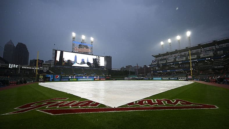 Jul 1, 2022; Cleveland, Ohio, USA; The tarp covers the field as the game between the Cleveland Guardians and the New York Yankees is delayed at Progressive Field. Mandatory Credit: Ken Blaze-USA TODAY Sports