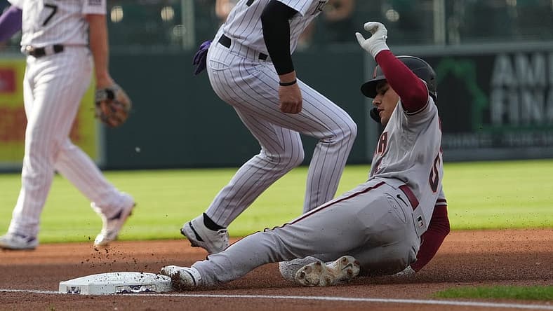 Jul 1, 2022; Denver, Colorado, USA; Arizona Diamondbacks center fielder Alek Thomas (5) RBI triples in the first inning against the Colorado Rockies at Coors Field. Mandatory Credit: Ron Chenoy-USA TODAY Sports