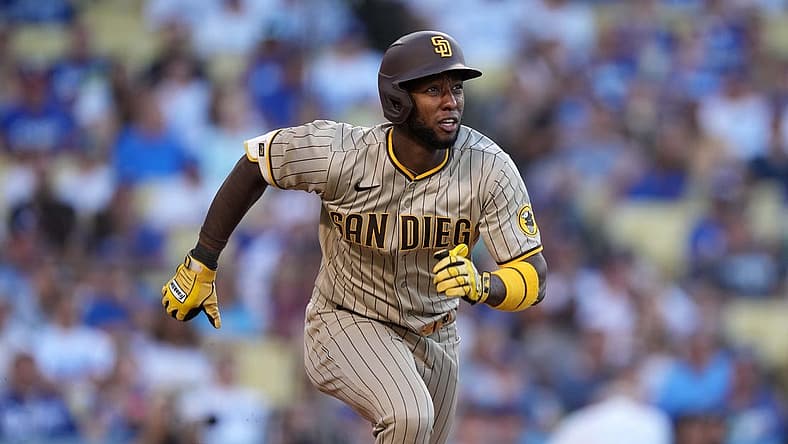 Jul 1, 2022; Los Angeles, California, USA; San Diego Padres left fielder Jurickson Profar (10) runs toward first base on a double in the first inning against the Los Angeles Dodgers at Dodger Stadium. Mandatory Credit: Kirby Lee-USA TODAY Sports