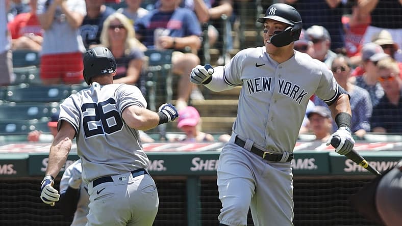 Jul 2, 2022; Cleveland, Ohio, USA; New York Yankees third baseman DJ LeMahieu (26) celebrates with designated hitter Aaron Judge (99) after hitting a home run during the third inning against the Cleveland Guardians at Progressive Field. Mandatory Credit: Ken Blaze-USA TODAY Sports