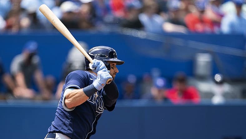Jul 2, 2022; Toronto, Ontario, CAN; Tampa Bay Rays center fielder Kevin Kiermaier (39) hits a single against the Toronto Blue Jays during the fifth inning at Rogers Centre. Mandatory Credit: Nick Turchiaro-USA TODAY Sports