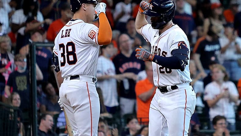 Jul 2, 2022; Houston, Texas, USA; Houston Astros left fielder Chas McCormick (20, right) is congratulated by Houston Astros catcher Korey Lee (38, left) after hitting a home run against the Los Angeles Angels during the seventh inning at Minute Maid Park. Mandatory Credit: Erik Williams-USA TODAY Sports