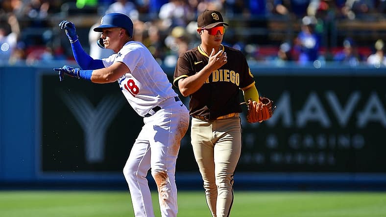 Jul 2, 2022; Los Angeles, California, USA; Los Angeles Dodgers designated hitter Jake Lamb (18) reacts after hitting an RBI double against the San Diego Padres during the third inning at Dodger Stadium. Mandatory Credit: Gary A. Vasquez-USA TODAY Sports