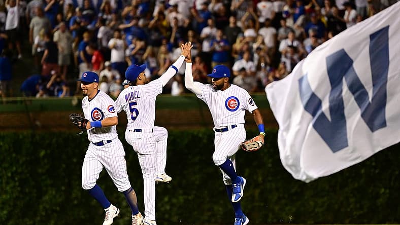 Jul 2, 2022; Chicago, Illinois, USA; Chicago Cubs left fielder Ian Happ (8), Chicago Cubs center fielder Narciso Crook (24), and Chicago Cubs center fielder Christopher Morel (5) celebrate after the 3-1 win against the Boston Red Sox at Wrigley Field. Mandatory Credit: Quinn Harris-USA TODAY Sports