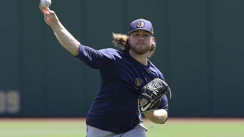 Jul 3, 2022; Pittsburgh, Pennsylvania, USA; Milwaukee Brewers pitcher Corbin Burnes (39) throws in the outfield before the game against the Pittsburgh Pirates at PNC Park. Mandatory Credit: Charles LeClaire-USA TODAY Sports