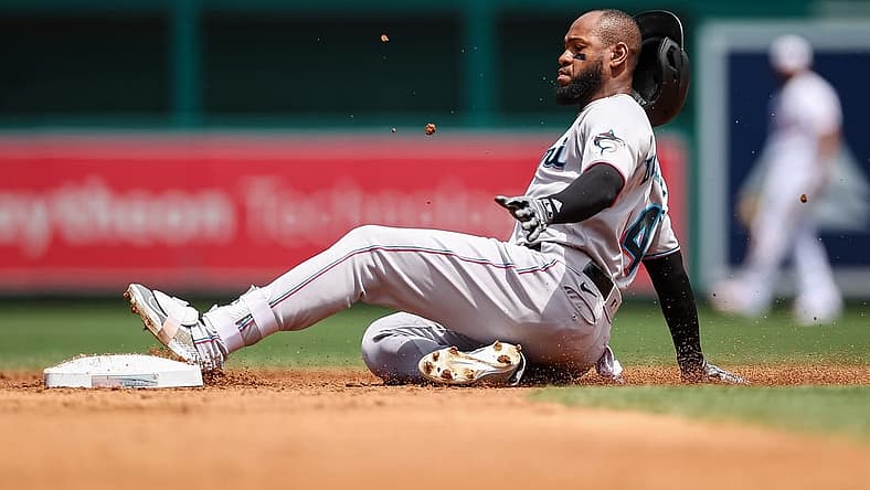 Jul 3, 2022; Washington, District of Columbia, USA; Miami Marlins left fielder Bryan De La Cruz (14) slides safely into second after hitting a double against the Washington Nationals during the third inning at Nationals Park. Mandatory Credit: Scott Taetsch-USA TODAY Sports