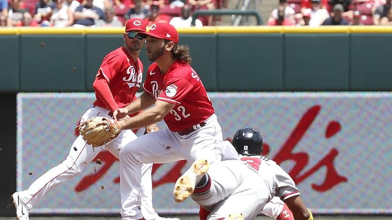 Jul 3, 2022; Cincinnati, Ohio, USA; Atlanta Braves right fielder Ronald Acuna Jr. (13) steals second against Cincinnati Reds second baseman Max Schrock (32) during the third inning at Great American Ball Park. Mandatory Credit: David Kohl-USA TODAY Sports