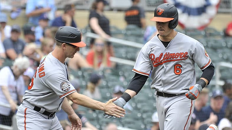 Jul 3, 2022; Minneapolis, Minnesota, USA; Baltimore Orioles first baseman Ryan Mountcastle (6) and third base coach Tony Mansolino (36) react after a home run by Mountcastle off Minnesota Twins starting pitcher Devin Smeltzer (not pictured) during the sixth inning at Target Field. Mandatory Credit: Jeffrey Becker-USA TODAY Sports
