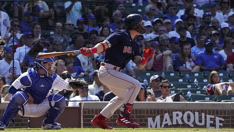 Jul 3, 2022; Chicago, Illinois, USA; Boston Red Sox center fielder Jarren Duran (40) hits a single against the Chicago Cubs during the sixth inning at Wrigley Field. Mandatory Credit: David Banks-USA TODAY Sports