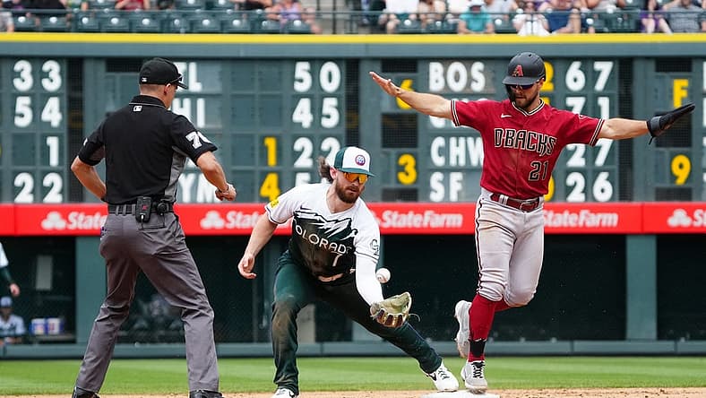 Jul 3, 2022; Denver, Colorado, USA; Colorado Rockies second baseman Brendan Rodgers (7) is unable to field the ball as Arizona Diamondbacks designated hitter Cooper Hummel (21 advances to second in the sixth inning at Coors Field. Mandatory Credit: Ron Chenoy-USA TODAY Sports