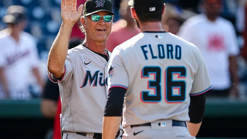 Jul 3, 2022; Washington, District of Columbia, USA; Miami Marlins manager Don Mattingly (8) and relief pitcher Dylan Floro (36) celebrate after the game against the Washington Nationals at Nationals Park. Mandatory Credit: Scott Taetsch-USA TODAY Sports