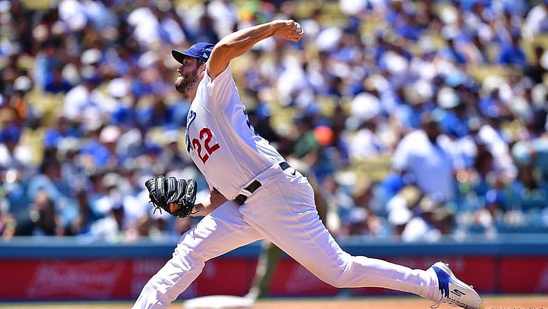 Jul 3, 2022; Los Angeles, California, USA; Los Angeles Dodgers starting pitcher Clayton Kershaw (22) throws against the San Diego Padres during the fourth inning at Dodger Stadium. Mandatory Credit: Gary A. Vasquez-USA TODAY Sports