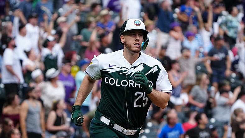 Jul 3, 2022; Denver, Colorado, USA; Colorado Rockies designated hitter C.J. Cron (25) runs off a three-run home run with in the eighth against the Arizona Diamondbacks at Coors Field. Mandatory Credit: Ron Chenoy-USA TODAY Sports
