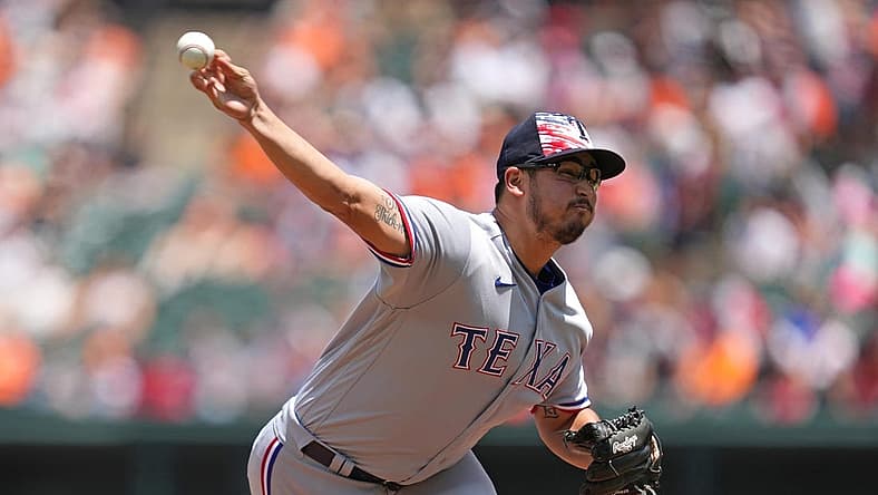 Jul 4, 2022; Baltimore, Maryland, USA; Texas Rangers pitcher Dane Dunning (33) delivers in the first inning against the Baltimore Orioles at Oriole Park at Camden Yards. Mandatory Credit: Mitch Stringer-USA TODAY Sports