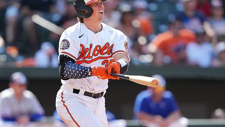 Jul 4, 2022; Baltimore, Maryland, USA; Baltimore Orioles catcher Adley Rutschman (35) reacts after his ninth inning double drove in the game tying run against the Texas Rangers at Oriole Park at Camden Yards. Mandatory Credit: Mitch Stringer-USA TODAY Sports