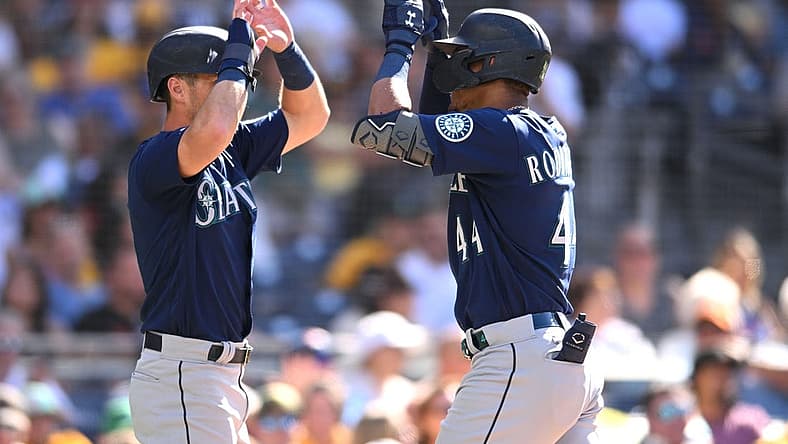 Jul 4, 2022; San Diego, California, USA; Seattle Mariners center fielder Julio Rodriguez (44) celebrates with left fielder Dylan Moore (left) after hitting a two-run home run during the fourth inning against the San Diego Padres at Petco Park. Mandatory Credit: Orlando Ramirez-USA TODAY Sports