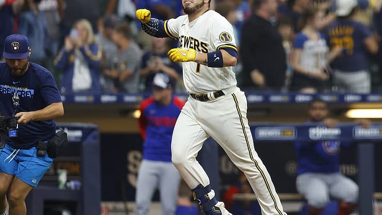 Jul 4, 2022; Milwaukee, Wisconsin, USA; Milwaukee Brewers catcher Victor Caratini (7) celebrates after hitting a three run home run during the tenth inning against the Chicago Cubs at American Family Field. Mandatory Credit: Jeff Hanisch-USA TODAY Sports