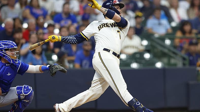 Jul 4, 2022; Milwaukee, Wisconsin, USA; Milwaukee Brewers catcher Victor Caratini (7) hits a three run home run during the tenth inning against the Chicago Cubs at American Family Field. Mandatory Credit: Jeff Hanisch-USA TODAY Sports