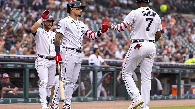 Jul 4, 2022; Detroit, Michigan, USA; Detroit Tigers second baseman Jonathan Schoop (7) celebrates with shortstop Javier Baez (middle) and left fielder Robbie Grossman (left) after scoring a run during the third inning against the Cleveland Guardians at Comerica Park. Mandatory Credit: Raj Mehta-USA TODAY Sports