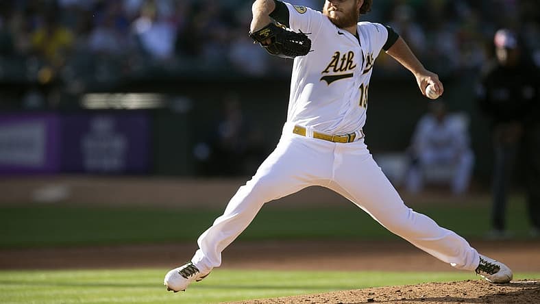 Jul 4, 2022; Oakland, California, USA; Oakland Athletics starting pitcher Cole Irvin (19) delivers a pitch against the Toronto Blue Jays in the second inning at RingCentral Coliseum. Mandatory Credit: D. Ross Cameron-USA TODAY Sports