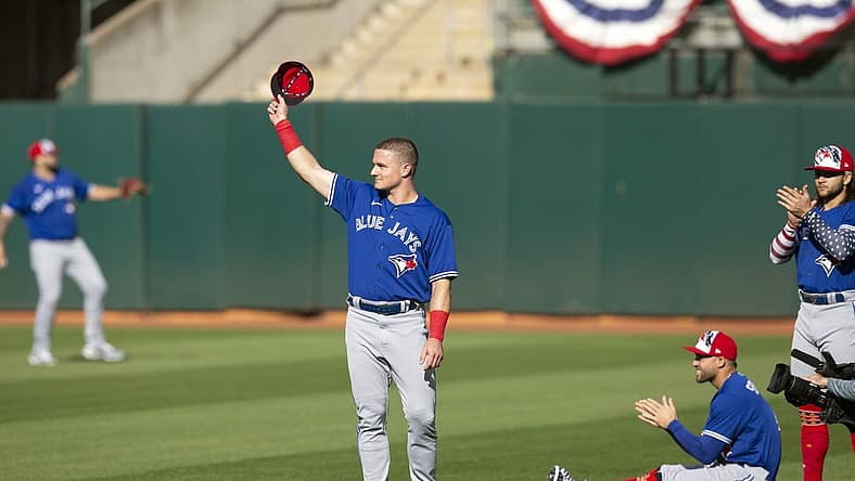 Jul 4, 2022; Oakland, California, USA; Toronto Blue Jays third baseman Matt Chapman (26) acknowledges the cheers of fans of his former team, the Oakland Athletics, before a game at RingCentral Coliseum. Mandatory Credit: D. Ross Cameron-USA TODAY Sports