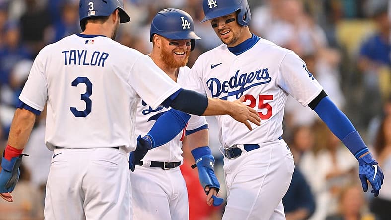 Jul 4, 2022; Los Angeles, California, USA; Los Angeles Dodgers right fielder Trayce Thompson (25) is met at the plate by left fielder Chris Taylor (3) and designated hitter Justin Turner (10) after hitting a three-run home run in the fifth inning against the Colorado Rockies at Dodger Stadium. Mandatory Credit: Jayne Kamin-Oncea-USA TODAY Sports