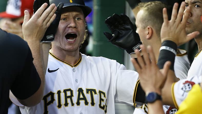 Jul 5, 2022; Pittsburgh, Pennsylvania, USA; Pittsburgh Pirates right fielder Jack Suwinski (65) high-fives in the Pirates dugout after hitting a two run home run against the New York Yankees during the fourth inning at PNC Park. Mandatory Credit: Charles LeClaire-USA TODAY Sports