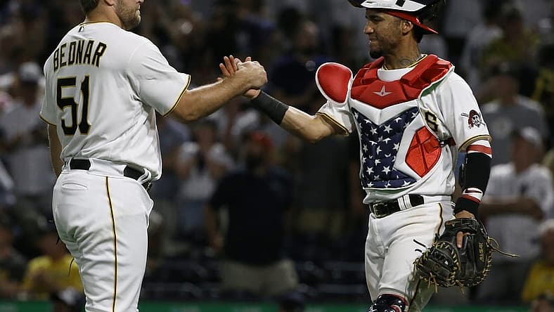 Jul 5, 2022; Pittsburgh, Pennsylvania, USA; Pittsburgh Pirates relief pitcher David Bednar (51) and catcher Michael Perez (5) celebrate after defeating the New York Yankees at PNC Park. The Pirates won 5-2. Mandatory Credit: Charles LeClaire-USA TODAY Sports